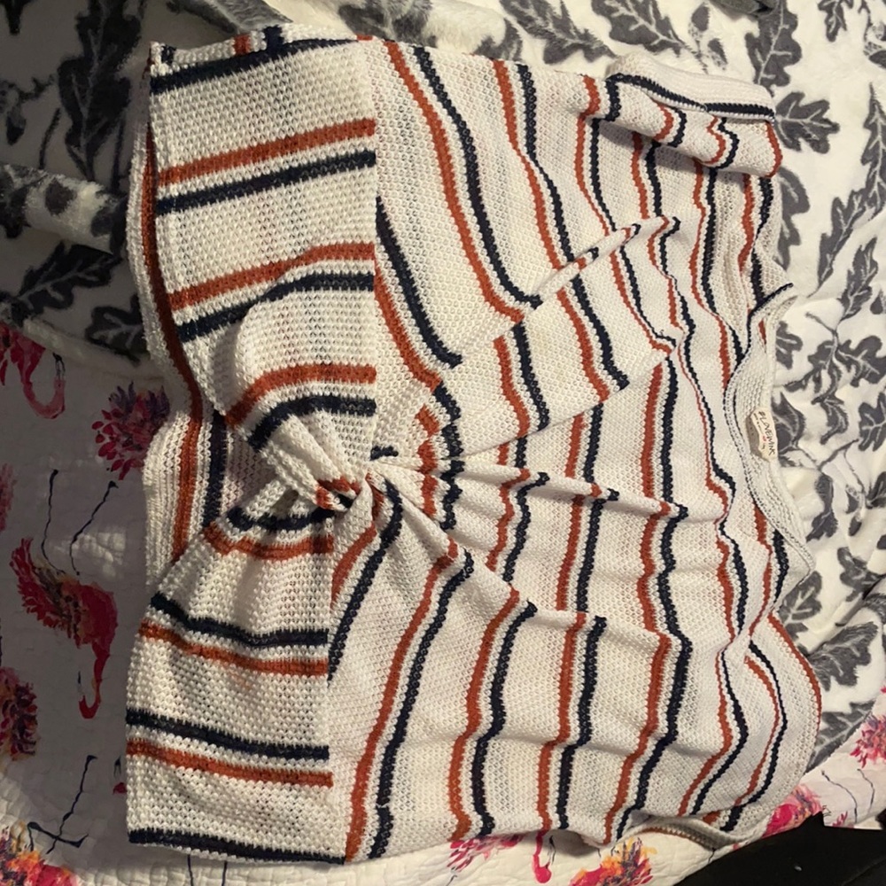 navy orange and white shirt the brand is #lovewins and it’s large made in Mexico